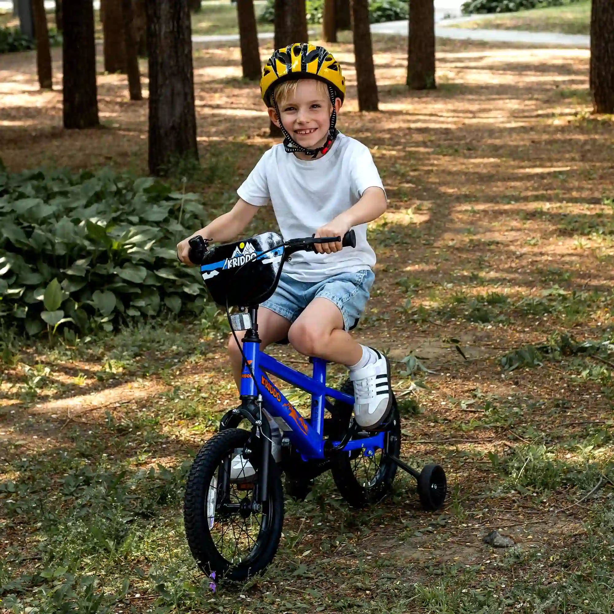 Little boy riding KRIDDO blue bicycle with training wheels