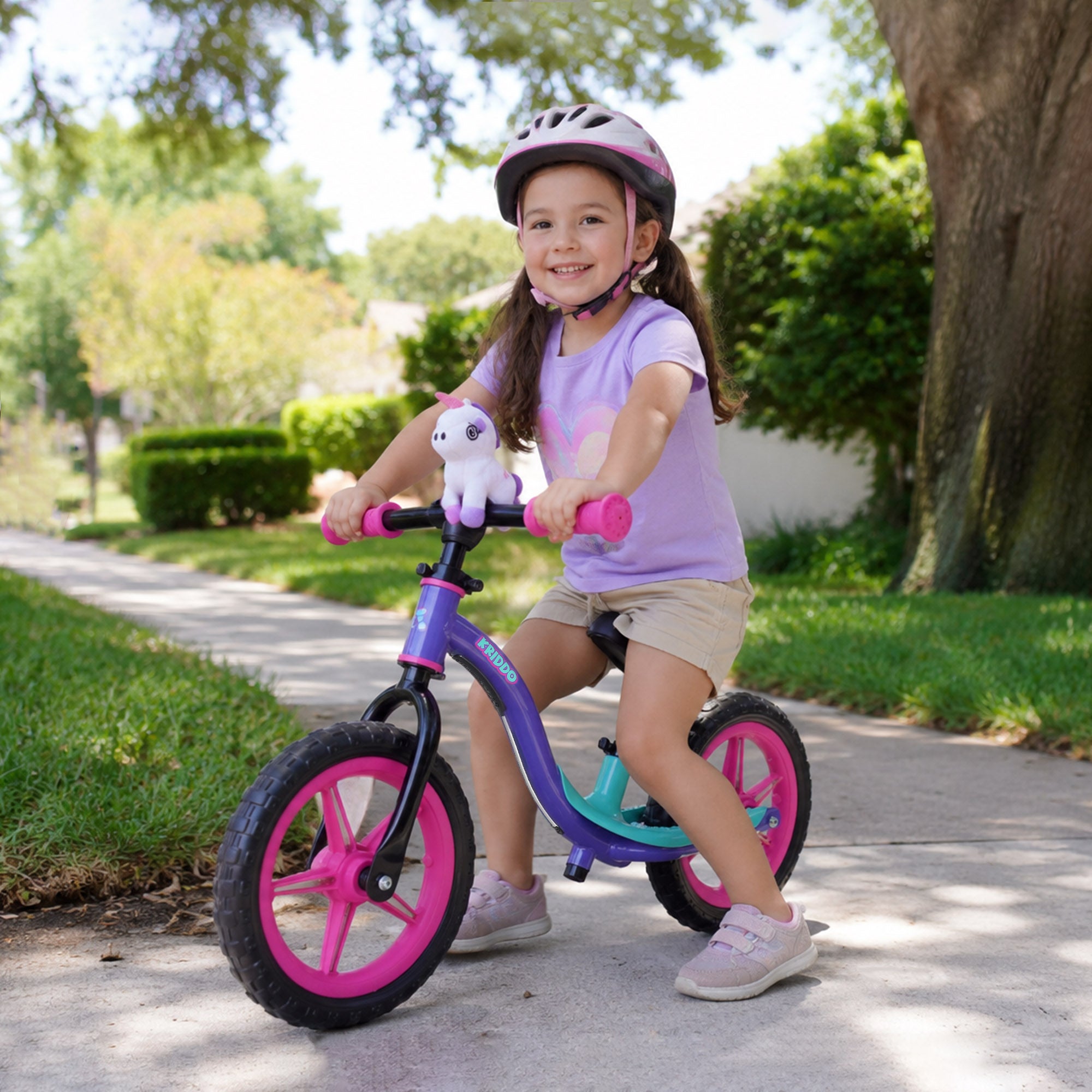 Little girl riding KRIDDO glowing balance bike on the road