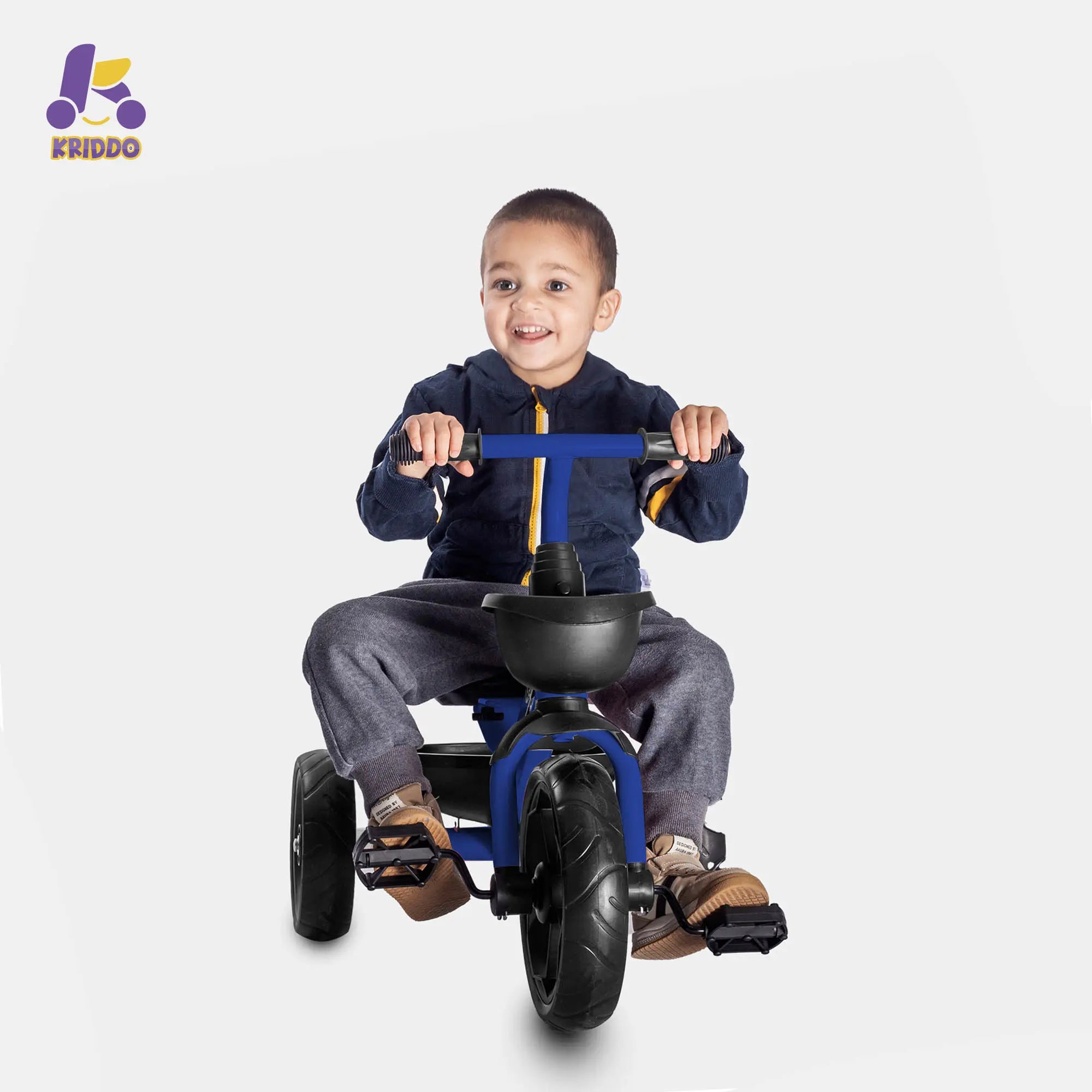 Boy riding a KRIDDO blue 3 wheel bike happily 