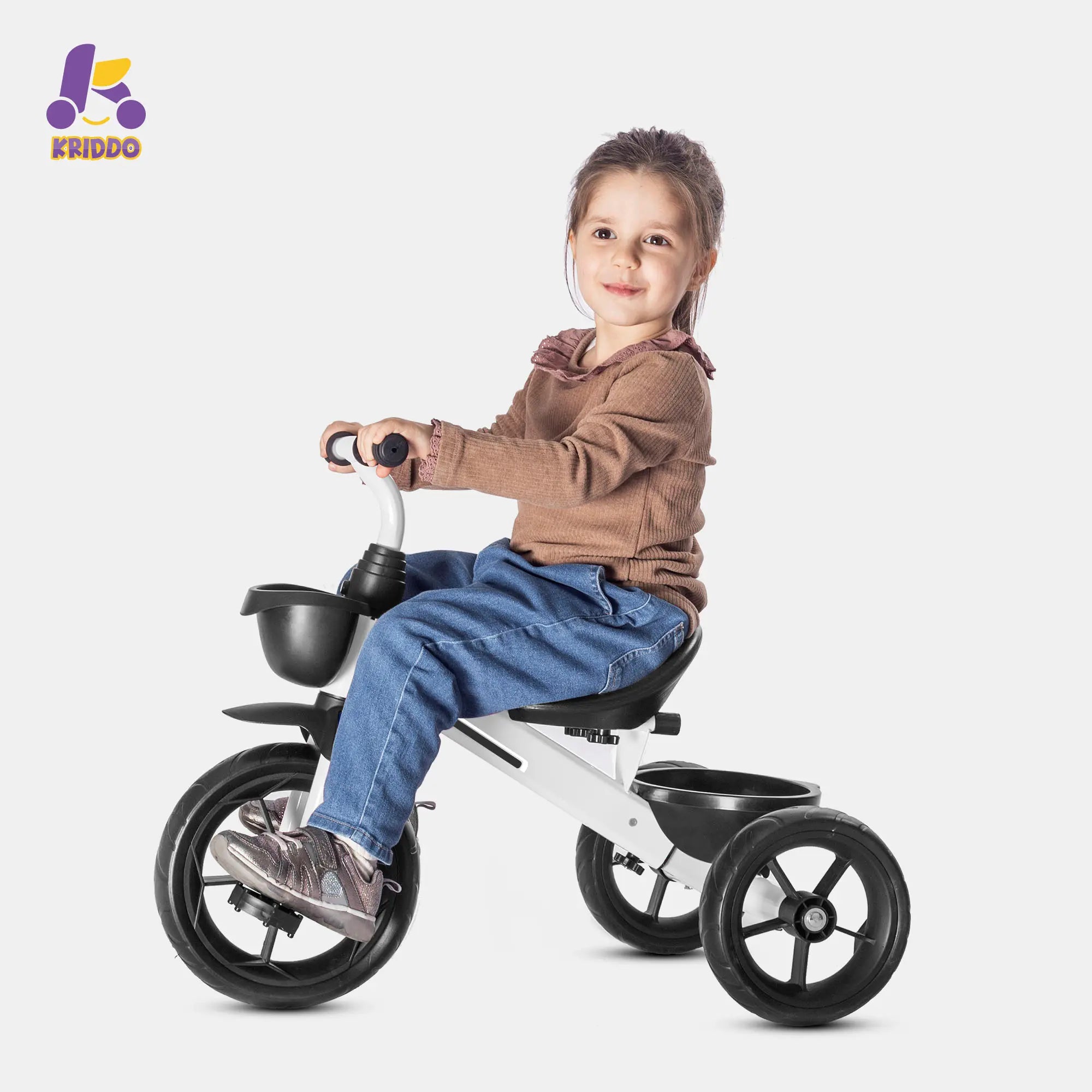 Toddler girl riding a KRIDDO white 3 wheel bike with a white background