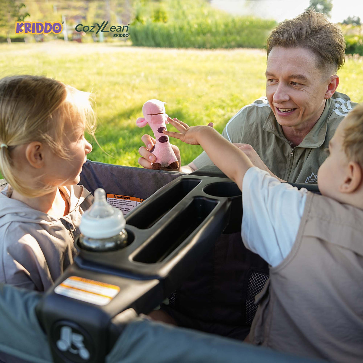 Father and two children enjoy time in KRIDDO 2 seater stroller outdoors.